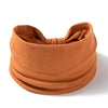 A terracotta colored boho wide headband hair wrap for women