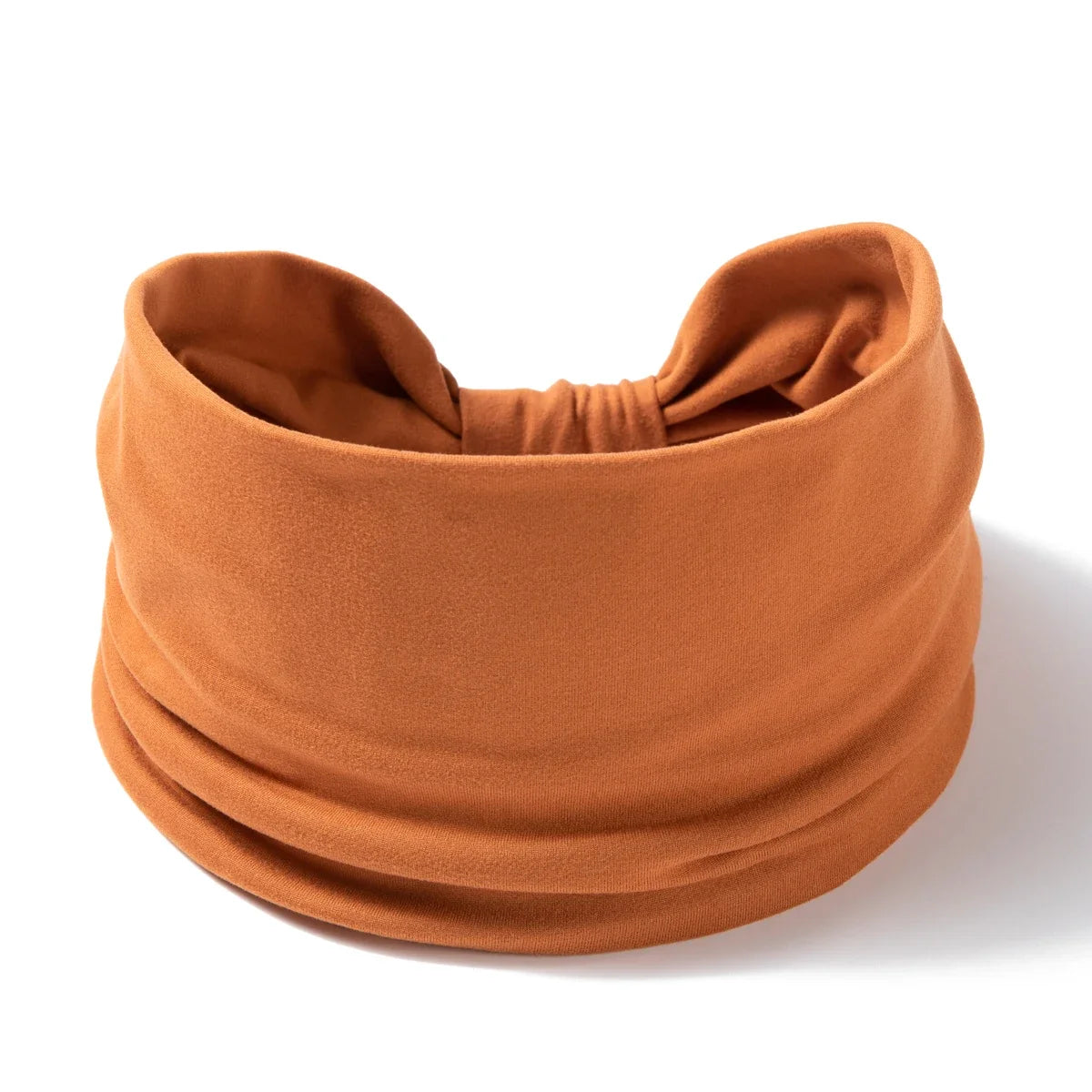 A terracotta colored boho wide headband hair wrap for women
