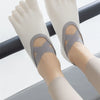 Pair of light gray five-finger invisible yoga and fitness socks worn on feet
