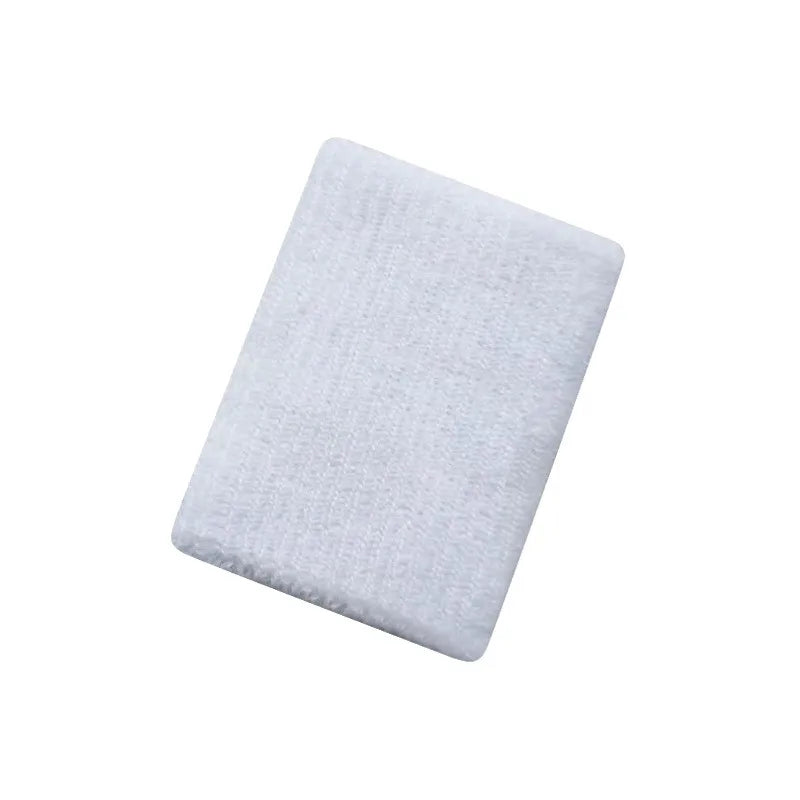 A white multi-sport breathable wristband is shown in a close-up view.