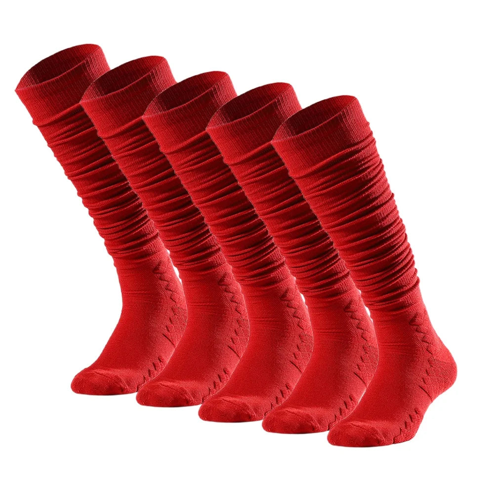 A row of red knee-high sports socks laid out, showing the texture and fit.