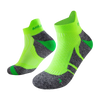 A pair of neon lime green performance sports ankle socks shown from the side.