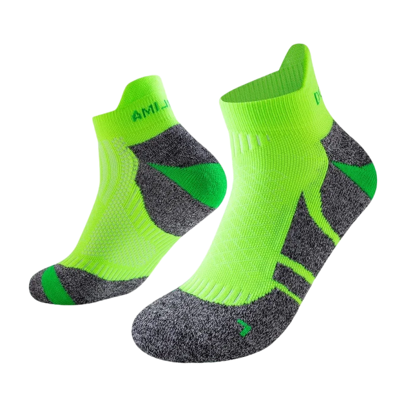 A pair of neon lime green performance sports ankle socks shown from the side.