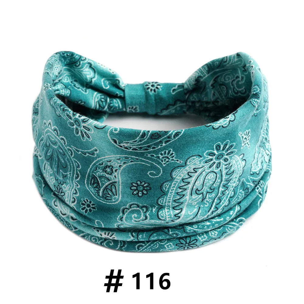 Teal satin fabric headband with an intricate white paisley print