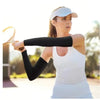 A woman wearing a white tank top and black arm guards is shown outdoors with a cycling helmet.