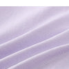 Close-up of a light purple, seamless fabric showing soft folds and texture.