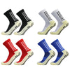 Ein Vierer-Pack strapazierfähige rutschfeste Sportsocken in Schwarz, Grau, Rot und Blau.