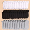 A collection of white, black, and gray soft lightweight ankle socks laid out in rows.