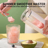 A hand crushes ice using a stainless steel knife head to make a smoothie, next to an avocado.