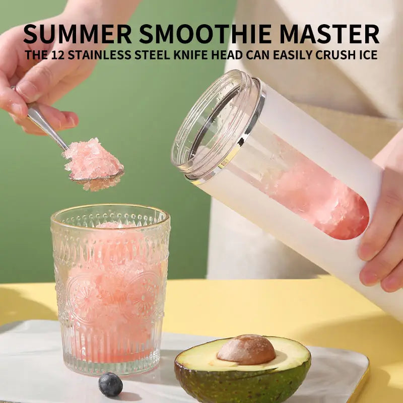 A hand crushes ice using a stainless steel knife head to make a smoothie, next to an avocado.
