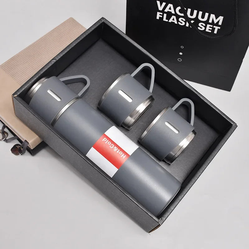 A set of three 500ml stainless steel vacuum flasks in gray and silver inside a black box.