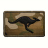 A dark silhouette of a kangaroo is embroidered on a tan camouflage fabric patch.