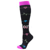 Black compression socks with pink and blue heart-shaped ECG line patterns.