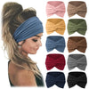 Colección de bandas para el cabello de tela en varios colores, incluyendo rosa, beige, verde oliva y azul oscuro, mostrados e