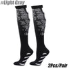 Pair of black compression socks with light gray lace detailing