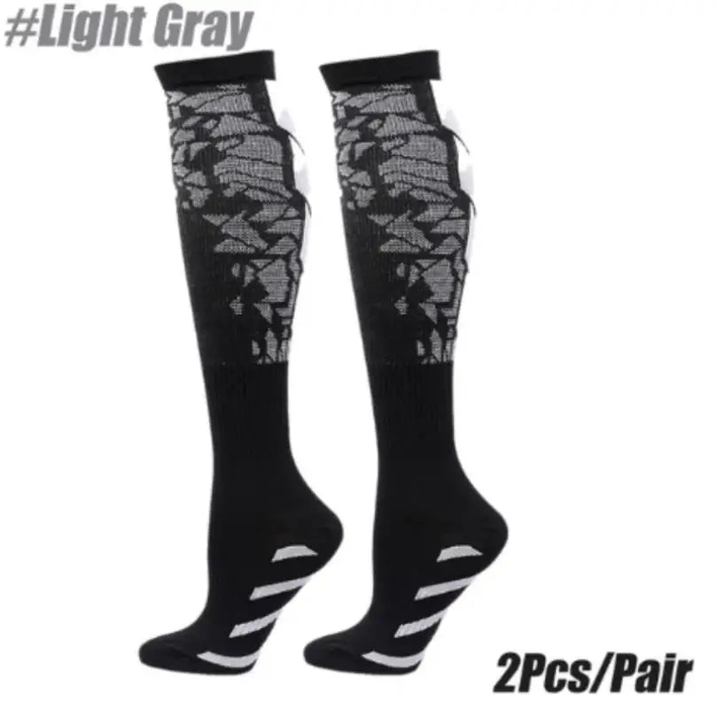 Pair of black compression socks with light gray lace detailing