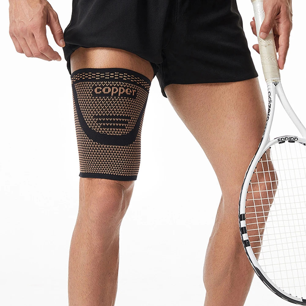 Anti-slip copper thigh compression sleeves worn on a person's leg.