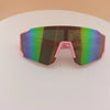 Pink-framed sports sunglasses with mirrored green and purple lenses resting on a white surface.