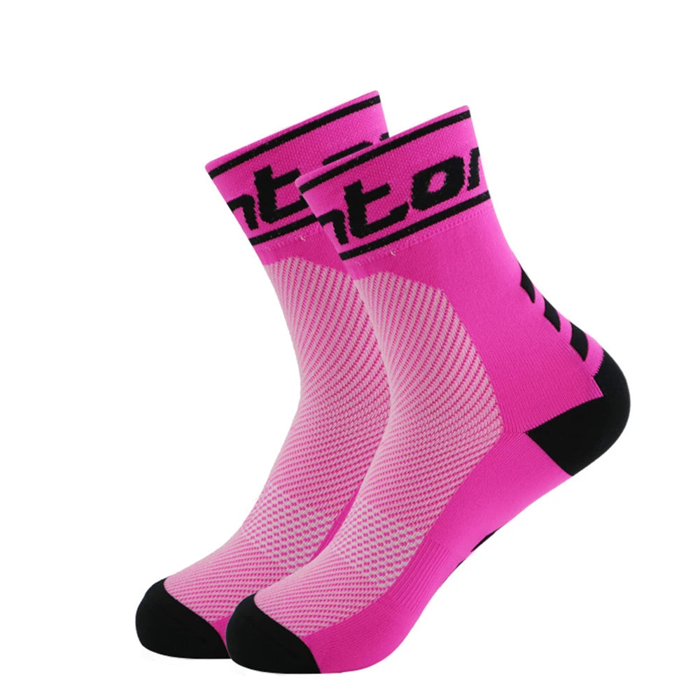 A pair of bright pink performance cycling and running socks shown from the side.