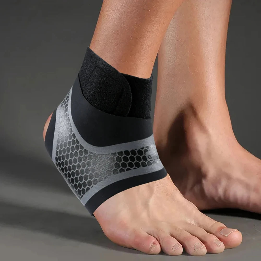 A person's ankle is wrapped in a black and gray compression brace for pain relief.