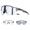 A pair of clear photochromic cycling sunglasses with black frames and UV400 protection.