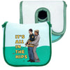 A light blue patterned golf putter headcover with a green trim and a matching green sleeve.