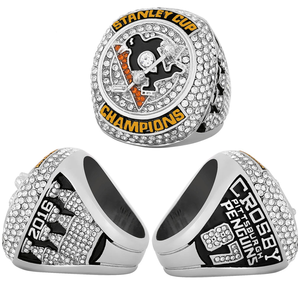 A pair of silver championship rings featuring a stylized logo and the year 2016.