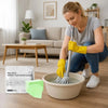 A woman is mopping a floor with a cleaning tool and yellow gloves, with a package of Aroma Floor Cleaning Tablets nearby.