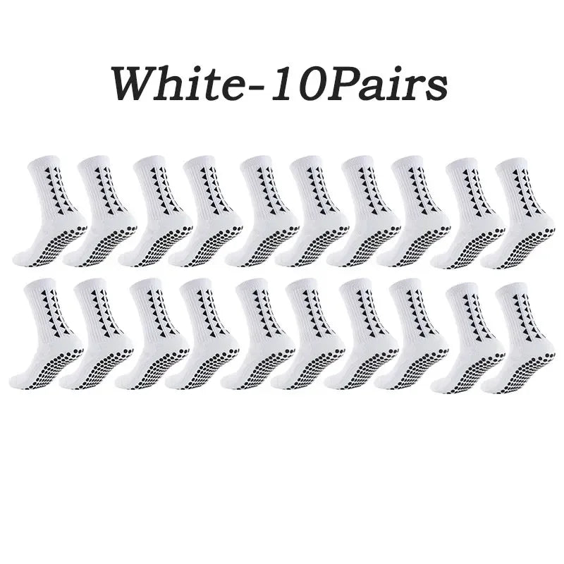 A set of ten pairs of white multi-sport athletic grip socks laid out in a row.