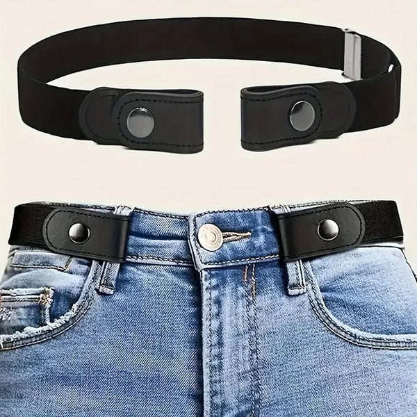 Black invisible stretch elastic belt with silver buckle shown alongside a pair of blue denim jeans.