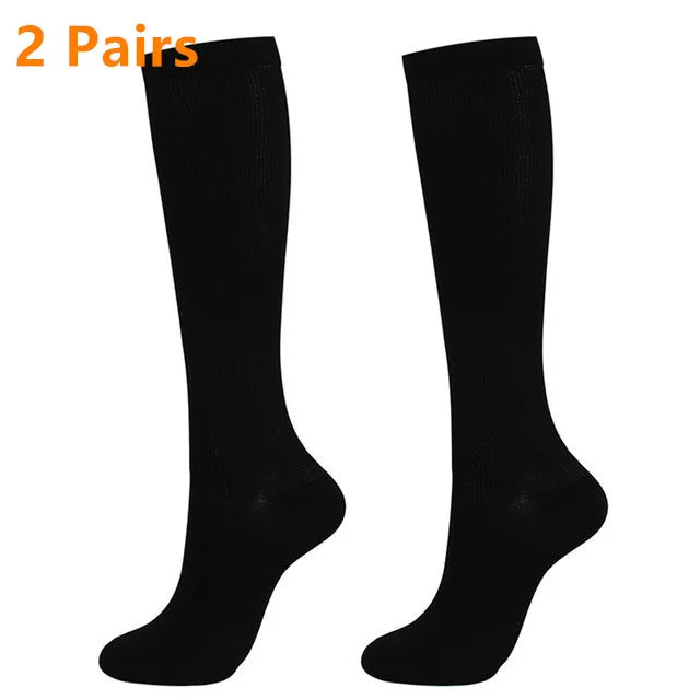 A pair of black high-compression knee-high stockings for circulation and comfort.