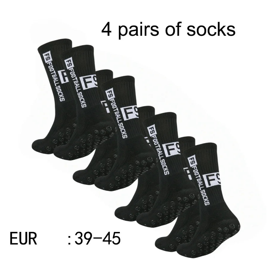 Four pairs of black men's athletic soccer socks with non-slip grip