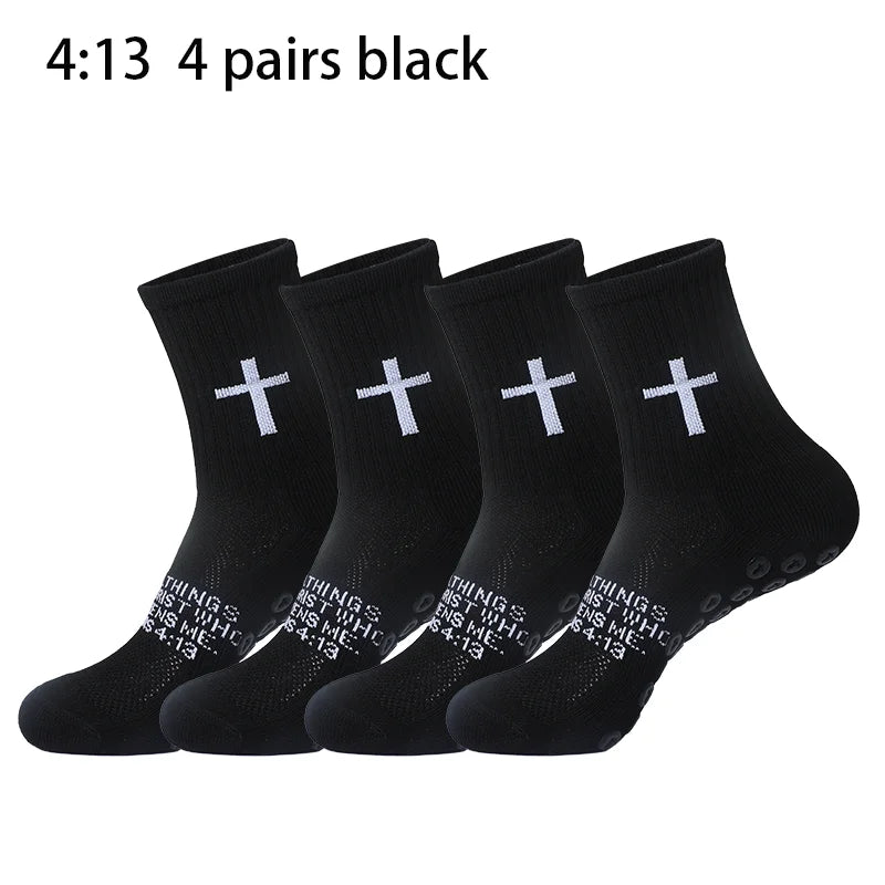 Four pairs of black prayer and cross grip sports socks are displayed.