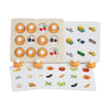 A set of wooden memory match puzzles featuring chess pieces and various fruits arranged on a light wood board.
