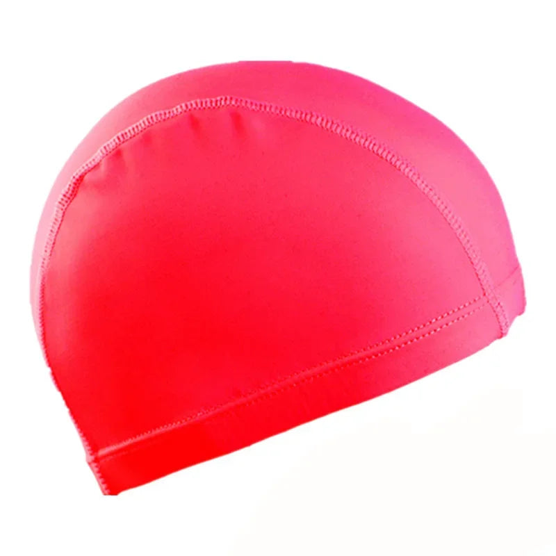 A bright pink swimming cap made of ultra-thin nylon, shown from a side angle.