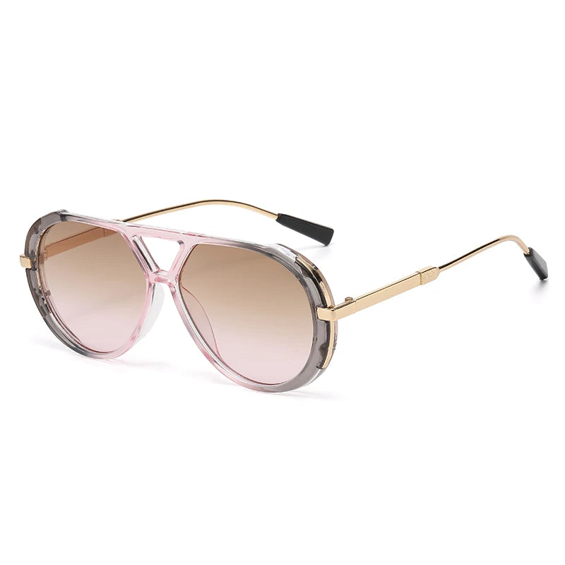 Vintage oversized designer sunglasses with pink tinted lenses and gold-toned metal frames