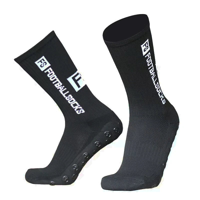 A pair of black anti-slip silicone grip football socks shown from the side.