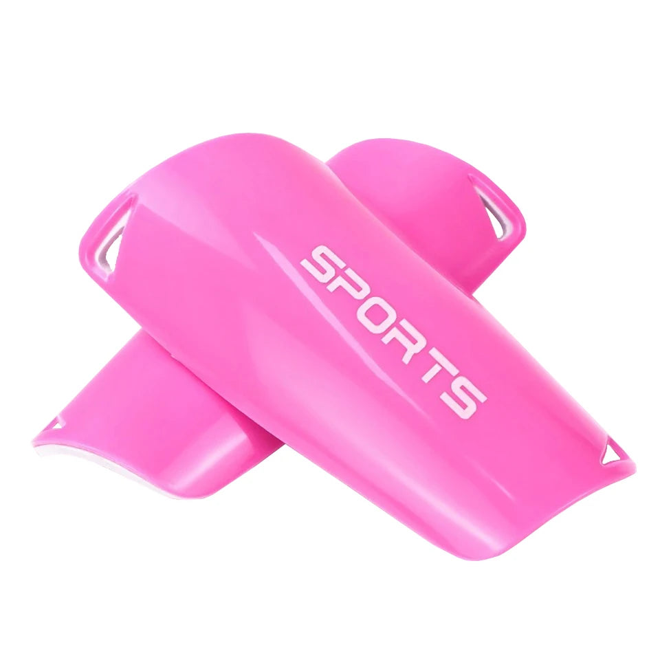 A bright pink sports shin guard for soccer players, shown from the side.