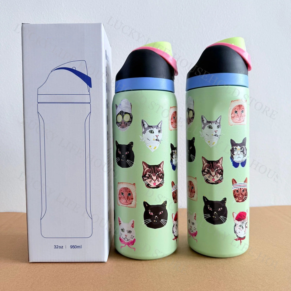 A pair of light green insulated sports water bottles with cat-themed designs and pink lids are shown next to their packaging 
