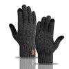 A pair of dark gray knitted winter gloves shown against a white background.
