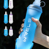 A hand holds a blue bottle of WELS Love Life Sport water bottle with multiple color options displayed above it.