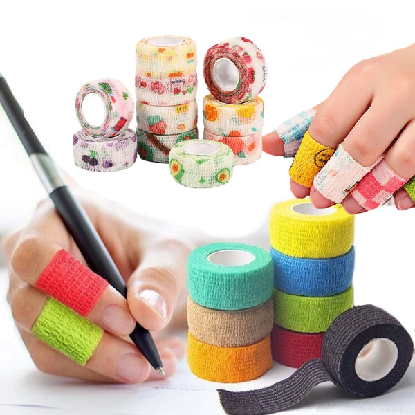 A hand is applying self-adhesive finger and joint bandages to a finger, with various rolls of colorful adhesive bandages visi