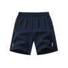 Navy blue men's lightweight quick-dry running shorts shown flat lay