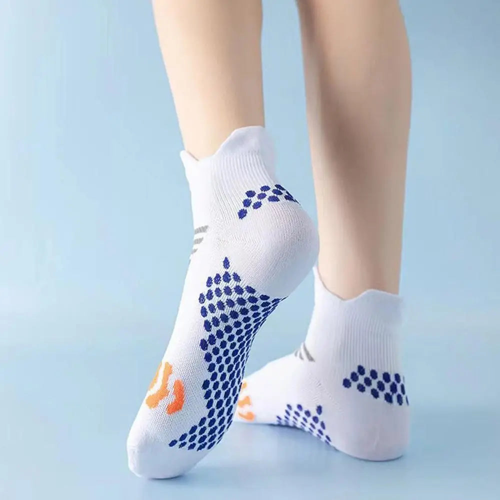 A close-up of white comfort fit cycling and running socks worn on a person's foot.