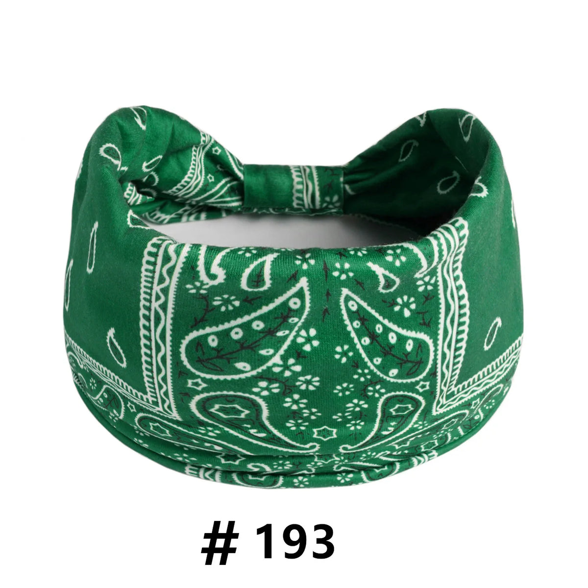A dark green boho print cotton headband tied in a bow.
