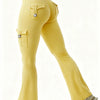 A model is wearing yellow high-waisted flared fitness pants with flap pockets.