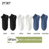 A set of six pairs of men's combed cotton socks in black, white, and navy blue colors.
