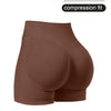 A pair of brown compression fit high-waisted knit fitness shorts.