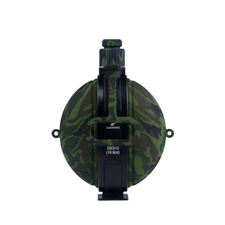 A black collapsible silicone camping kettle with a camouflage green and brown pattern.