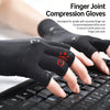 Black finger joint compression gloves being worn on a hand typing on a laptop keyboard.